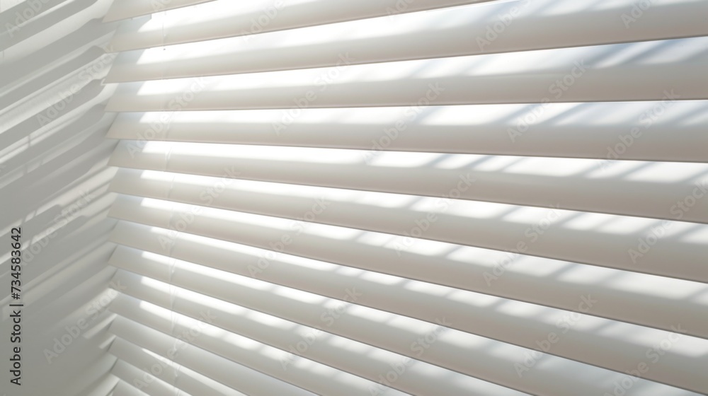Sunlight streams through white venetian blinds, casting soft shadows in a tranquil room. Sunlight streams through white venetian blinds, casting soft shadows in a tranquil room.