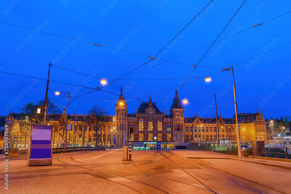 Amsterdam Netherlands, night city skyline at Amsterdam Central Station