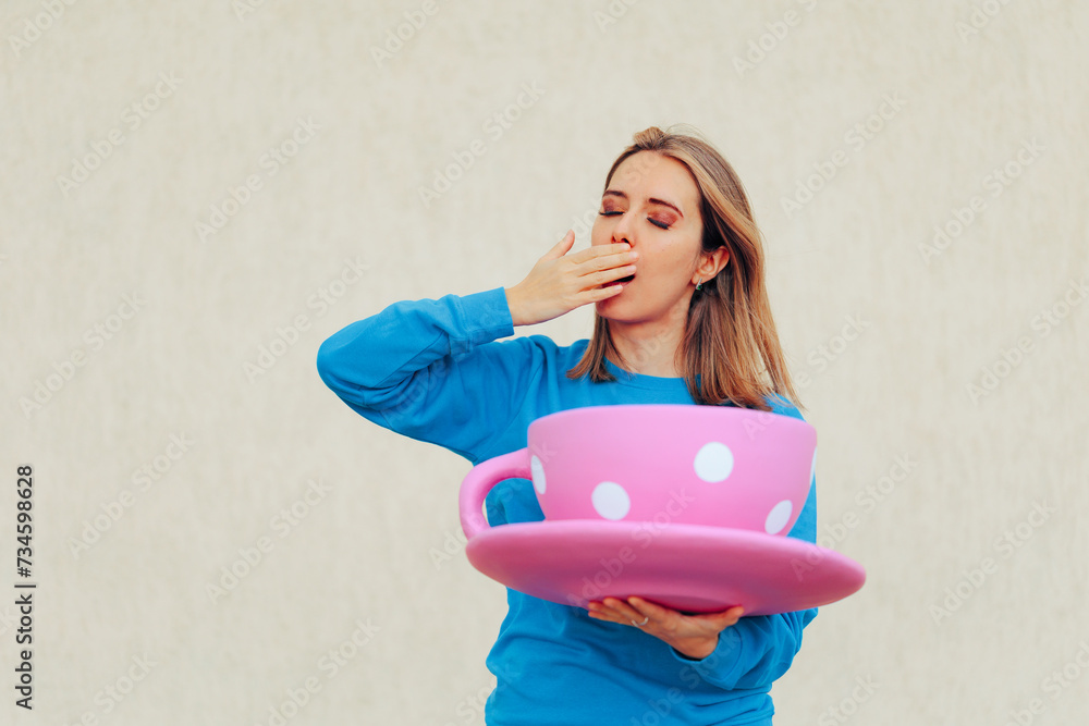 Sleepy Woman Yawning Holding a Huge Cup of Coffee. Tired exhausted burnout person addicted to caffeine
Sleepy Woman Yawning Holding a Huge Cup of Coffee. Tired exhausted burnout person addicted to caffeine