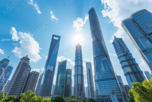 view of a modern city skyline with skyscrapers and a blue sky