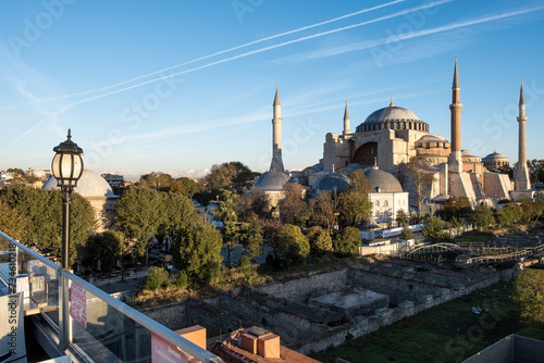 View of Hagia Sophia from a rooftop terrace restaurant in Istanbul, Turkey. Initially a 6th-century church, it transformed into a mosque, then a museum, and was officially reconverted in 2020. photo