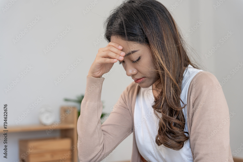 Depression and mental illness. Asian woman disappointed, sad after receiving bad news. Stressed girl confused with unhappy problems, arguing with boyfriend, cry and worry about unexpected pregnancy Depression and mental illness. Asian woman disappointed, sad after receiving bad news. Stressed girl confused with unhappy problems, arguing with boyfriend, cry and worry about unexpected pregnancy