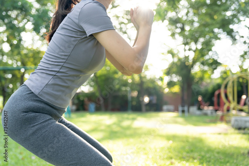 health care female exert on the park. Asian woman doing exercises in morning. balance, recreation, relaxation, calm, good health, happy, relax, healthy lifestyle, reduce stress, peaceful, Attitude.. photo