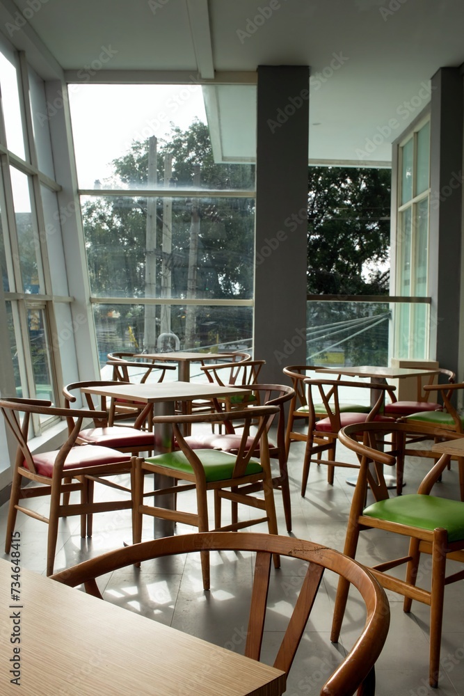 Obraz premium colorful wooden chairs on the balcony with city views
