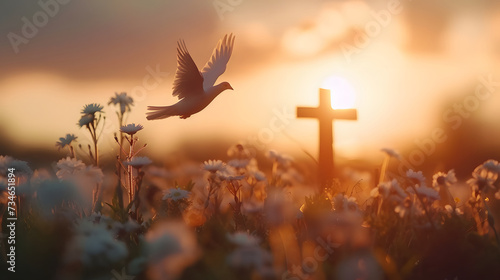 Winged Dove flying in front of the cross at sunset. Christian concept photo