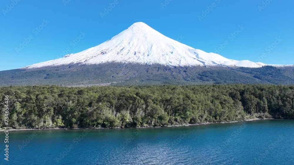 Osorno Vulcan At Osorno Los Lagos Chile. River Background Osorno Los Lagos. Nature Tourism Icon Snow Covered Forest Trees. Nature Landmark Snow Covered Patagonia High Angle View. Osorno Vulcan At Osorno Los Lagos Chile. River Background Osorno Los Lagos. Nature Tourism Icon Snow Covered Forest Trees. Nature Landmark Snow Covered Patagonia High Angle View.