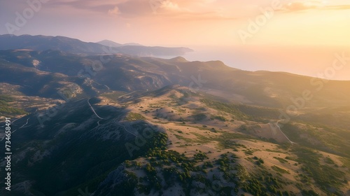 Wide angle aerial view of Mediterranean and mountainous landscape at sunrise
