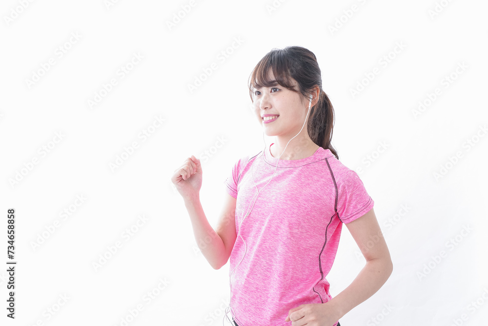 ランニングをする若い女性 ランニングをする若い女性
