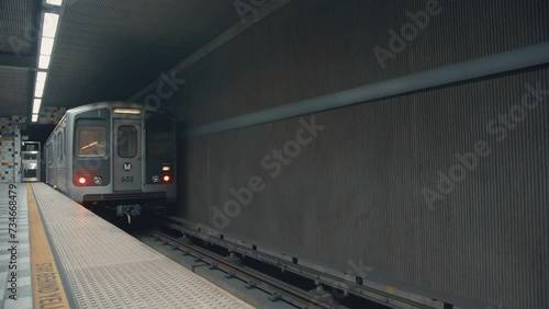 Train leaving metro station. American subway in California. Moving train underground. Departing from metro station. Train leaving Hollywood Western. Moving subway in Los Angeles. Traveling by subway.