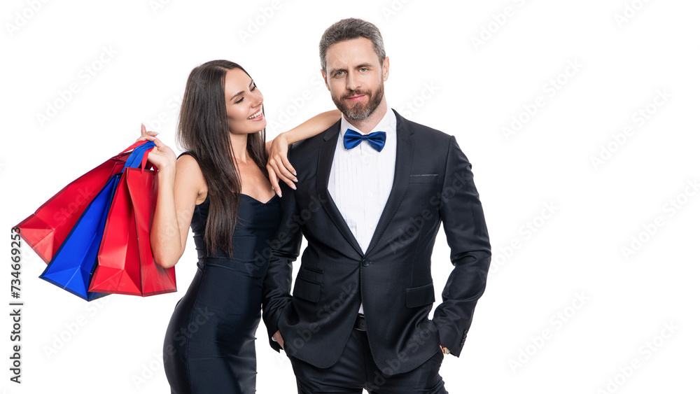 Big sale and shopping with couple. Couple holding shopping bags isolated white. Couple with shopper bags in mall. Purchasing present together. Two man and woman in shop mall. Banner advertisement Big sale and shopping with couple. Couple holding shopping bags isolated white. Couple with shopper bags in mall. Purchasing present together. Two man and woman in shop mall. Banner advertisement