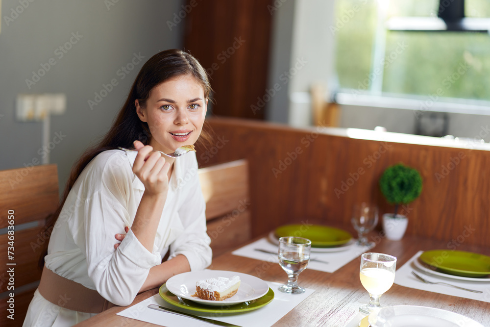 Romantic Dinner at Home Smiling Woman Enjoying a Delicious Meal on a Trendy Dining Table