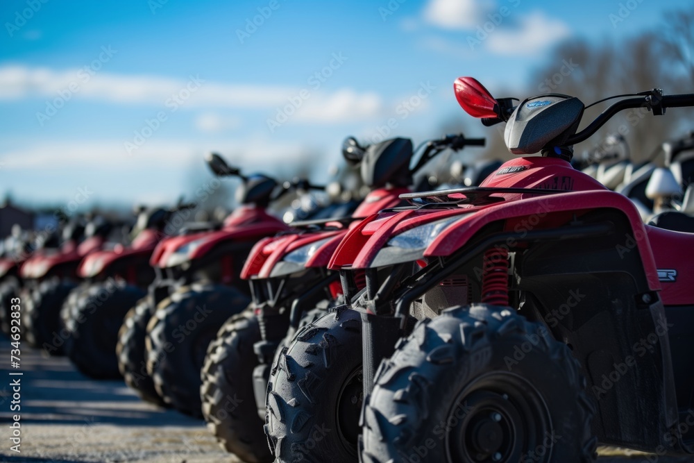 atvs parked in line at a rental facility atvs parked in line at a rental facility