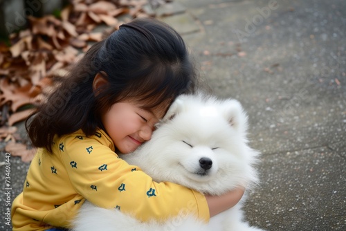 a child hugging a fluffy white kishu dog