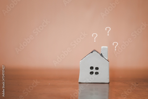 House model and question mark. Decision to choose the best property. Checklist for transfer ownership of land, Home loan, Financial and banking, Real estate investment and asset management.