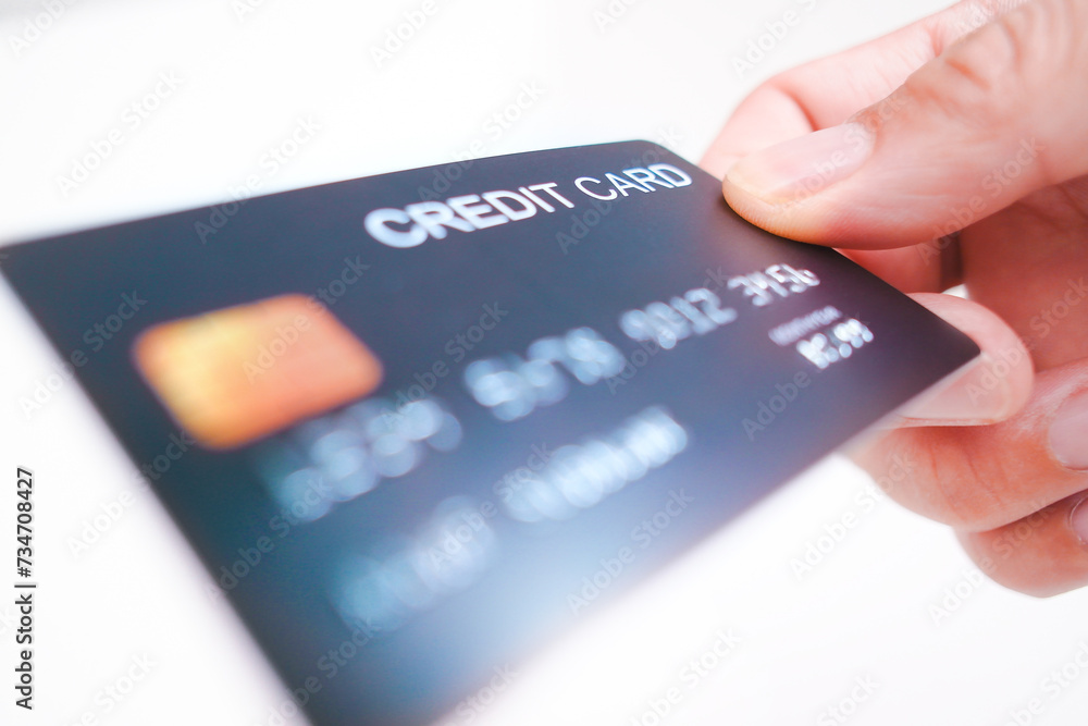 Credit card in a hand on white background , Credit card and financial concept Credit card in a hand on white background , Credit card and financial concept
