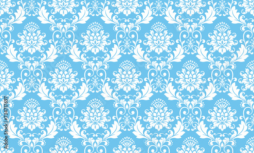Wallpaper in the style of Baroque. Seamless vector background. White and blue floral ornament. Graphic pattern for fabric, wallpaper, packaging. Ornate Damask flower ornament