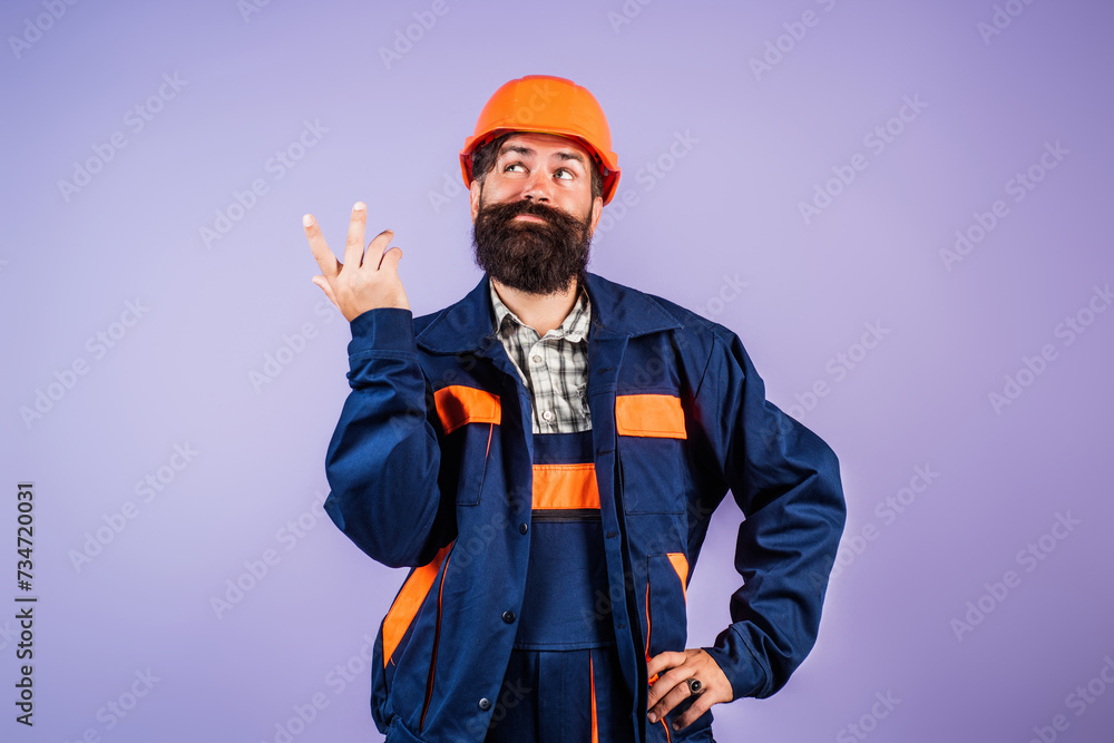 Funny bearded man in helmet. Crazy fun face of builder with Building equipment and hardhat, safety Helmet. Man in hardhat, Renovation concept. Builder and hard job. Construction man, contractor Funny bearded man in helmet. Crazy fun face of builder with Building equipment and hardhat, safety Helmet. Man in hardhat, Renovation concept. Builder and hard job. Construction man, contractor