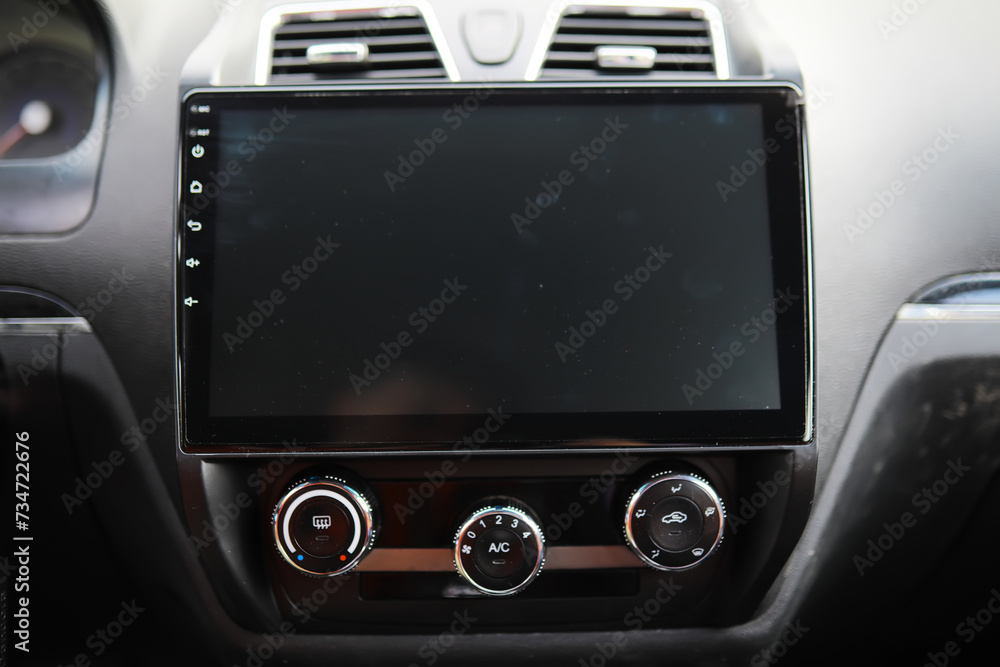Fototapeta premium The process of choosing climate control in the car. Various controls in auto switches. Modern car interior