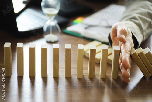 Fotografía Closeup thick domino wood block in a row stop the falling, be stable in crisis,