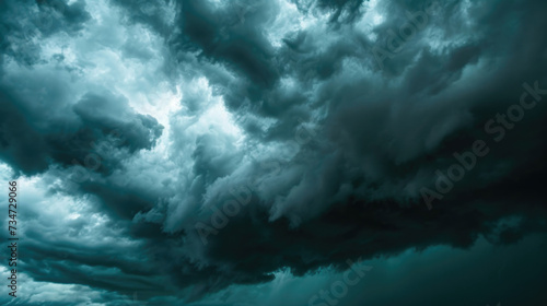 Large storm cloud is seen moving towards ocean. This image can be used to depict approaching bad weather or to emphasize power and intensity of nature.