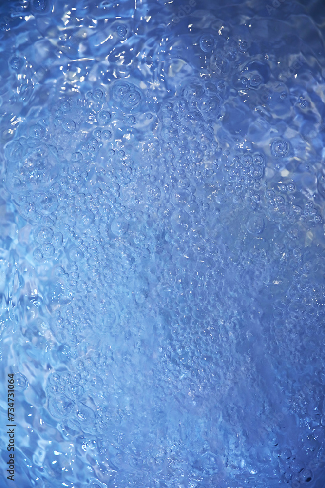 Fototapeta premium Blue water texture. Bubbles and bubbling water.
