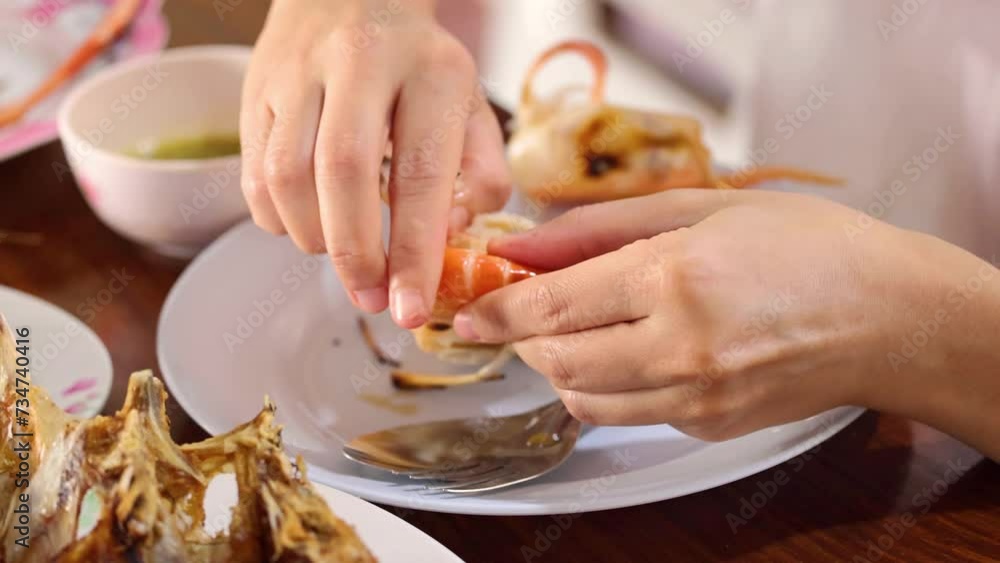 Peeling Shrimp at the Dinner Table Peeling Shrimp at the Dinner Table