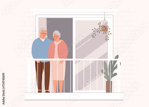 Smiling Elderly Couple Standing On The Apartment Balcony. Full Length.