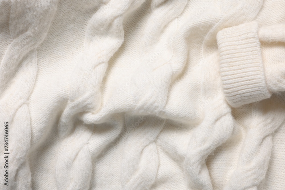 Texture of soft white knitted fabric as background, top view Texture of soft white knitted fabric as background, top view