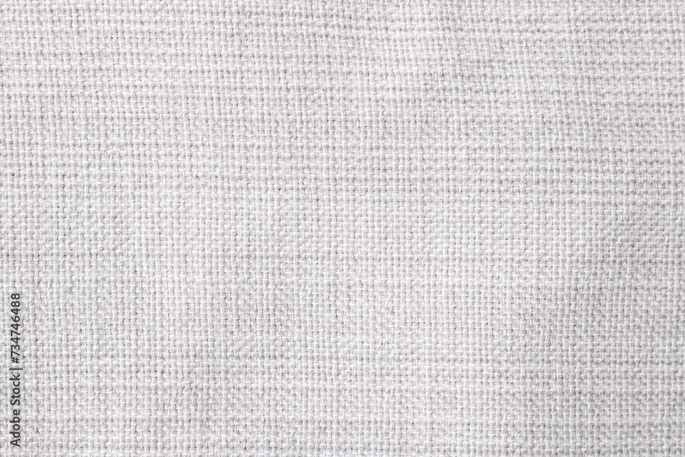 Fototapeta premium Texture of white fabric as background, top view