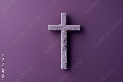 Simple stone cross on a purple background, symbolizing faith and solemnity