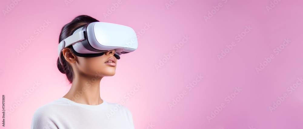 20-year-old Caucasian girl wearing wireless VR glasses his expression reflecting deep concentration as he explores virtual reality against a solid pastel background with copy space