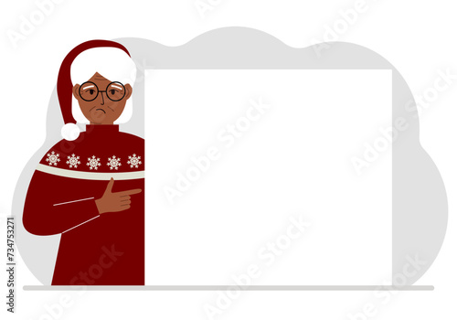 A woman in a red sweater near a large white sheet. Advertising, invitation, discount for Christmas or New Year.