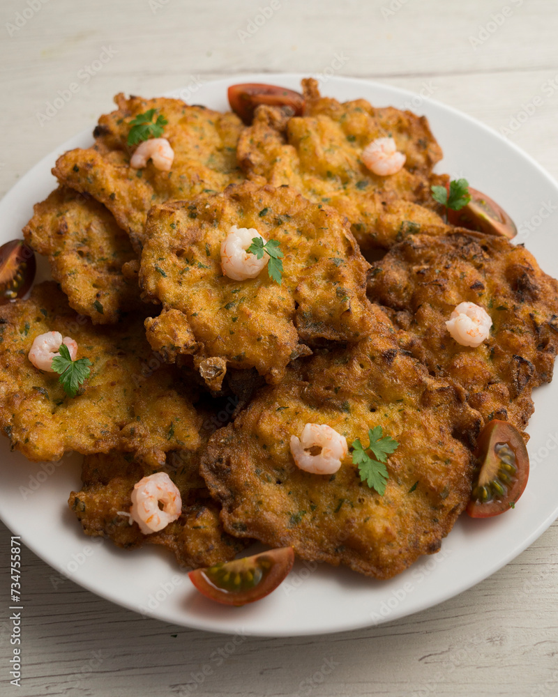 Tortitas de Camarones. Traditional tapa of flour and egg dough with shrimp or prawns, very famous in the Cadiz area in Spain. Tortitas de Camarones. Traditional tapa of flour and egg dough with shrimp or prawns, very famous in the Cadiz area in Spain.