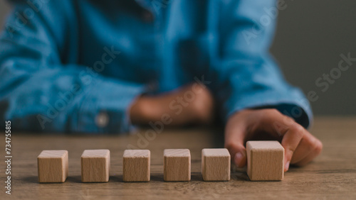 Blank wooden cubes on the table with copy space, empty wooden cubes for input wording, and an infographic icon.