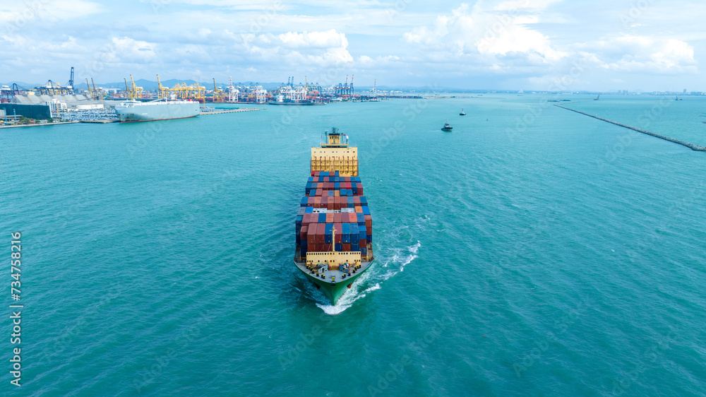 front view Cargo Container ship with contrail in the ocean ship carrying container and running for import export concept technology freight shipping by ship