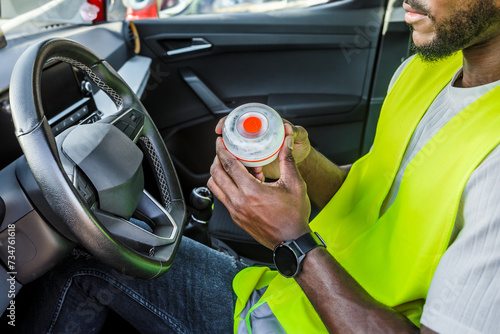 Man in reflective vest holding emergency light photo