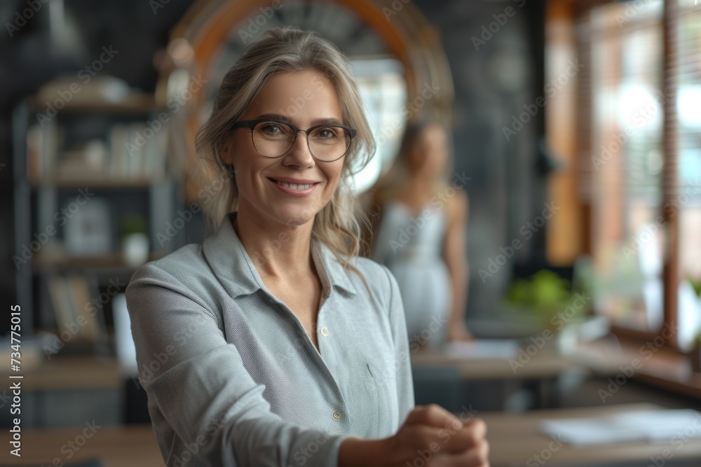 A smiling businesswoman with blonde hair in an urban setting A smiling businesswoman with blonde hair in an urban setting