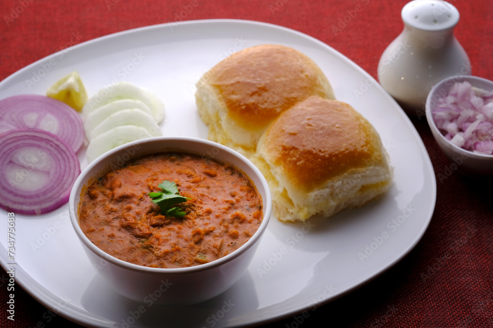 Pav bhaji is a fast food dish from India consisting of a thick vegetable curry served with bread. Pav bhaji is a fast food dish from India consisting of a thick vegetable curry served with bread.
