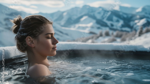 Young Caucasian woman resting in hot tub with view on mountains in winter, spa, hot spring, outdoor bath - Generative AI