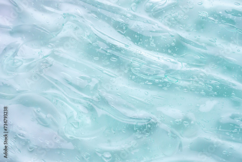 Transparent clear blue liquid serum gel cosmetic texture background