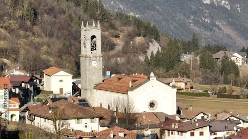 Aerial drone view of Town in dolomites in Italty. dItalian mountain town Berguzzo in alps. Adamello Brenta park in dolomites Trentino. Sunny winter day in small town in the Italian mountains. photo