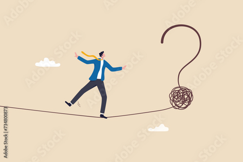 Uncertainty, unknown problem, challenge to overcome or investment risk, find out solution for business difficulty, adversity or determination, businessman acrobat rope walking to find question mark.