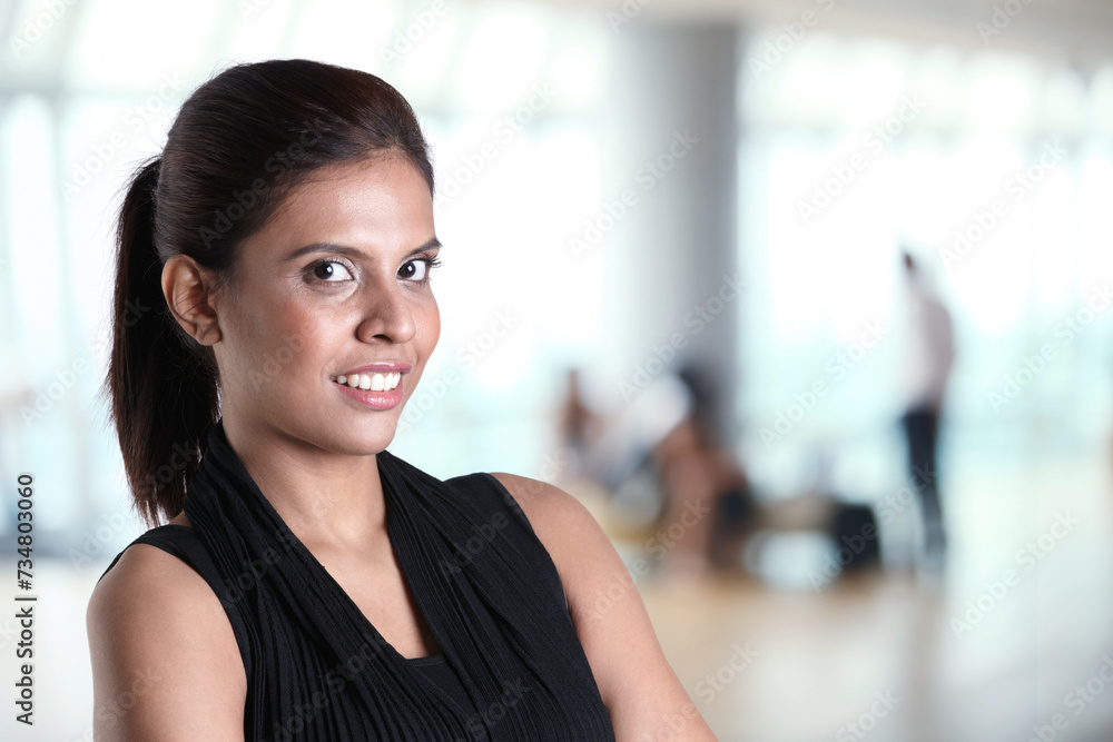Fototapeta premium Asian business woman with her arms crossed