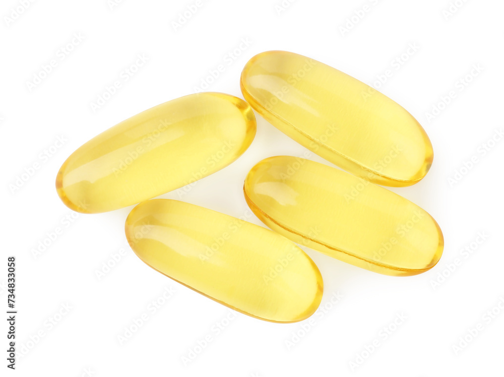 Many yellow vitamin capsules isolated on white, top view Many yellow vitamin capsules isolated on white, top view