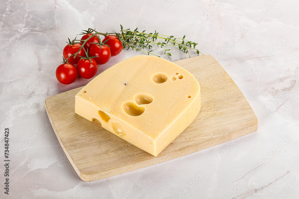 Maasdam cheese brick over board Maasdam cheese brick over board