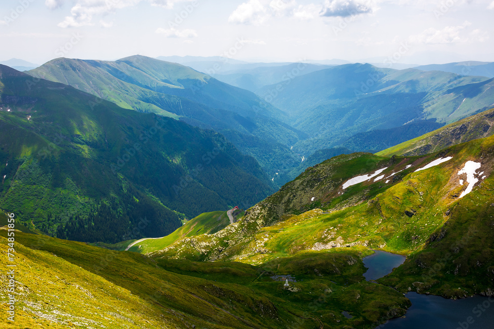 spectacular view of a valley in fagaras mountains from above. mountainous landscape of romania in summer. popular travel destination