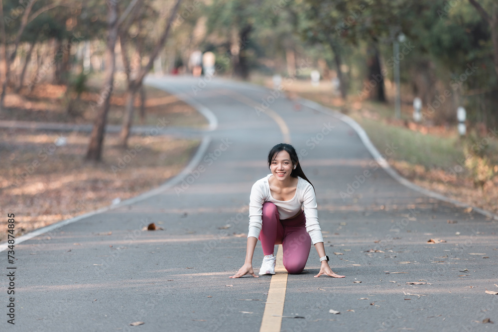 A fit woman enjoys a healthy jog in a park filled with summery green A fit woman enjoys a healthy jog in a park filled with summery green