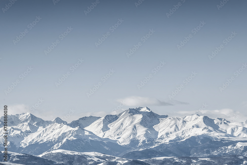 Snowcapped peaks. Winter mountain ridge.