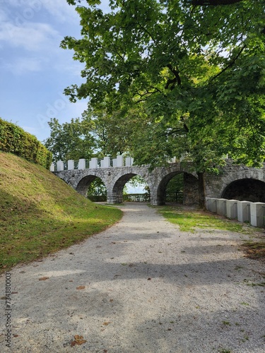 Arched stone bridge in the park in Ljubljana
