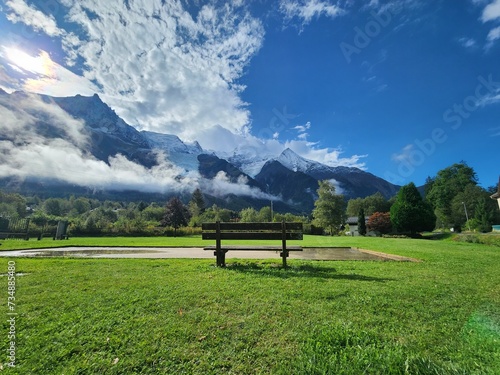 Chamonix snowy mountain view with empty bench